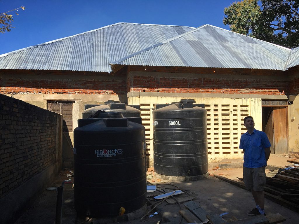 outside the sisters house Mtandi, visited by John Talbot and Bishop James project funded by African Palms selling palm crosses